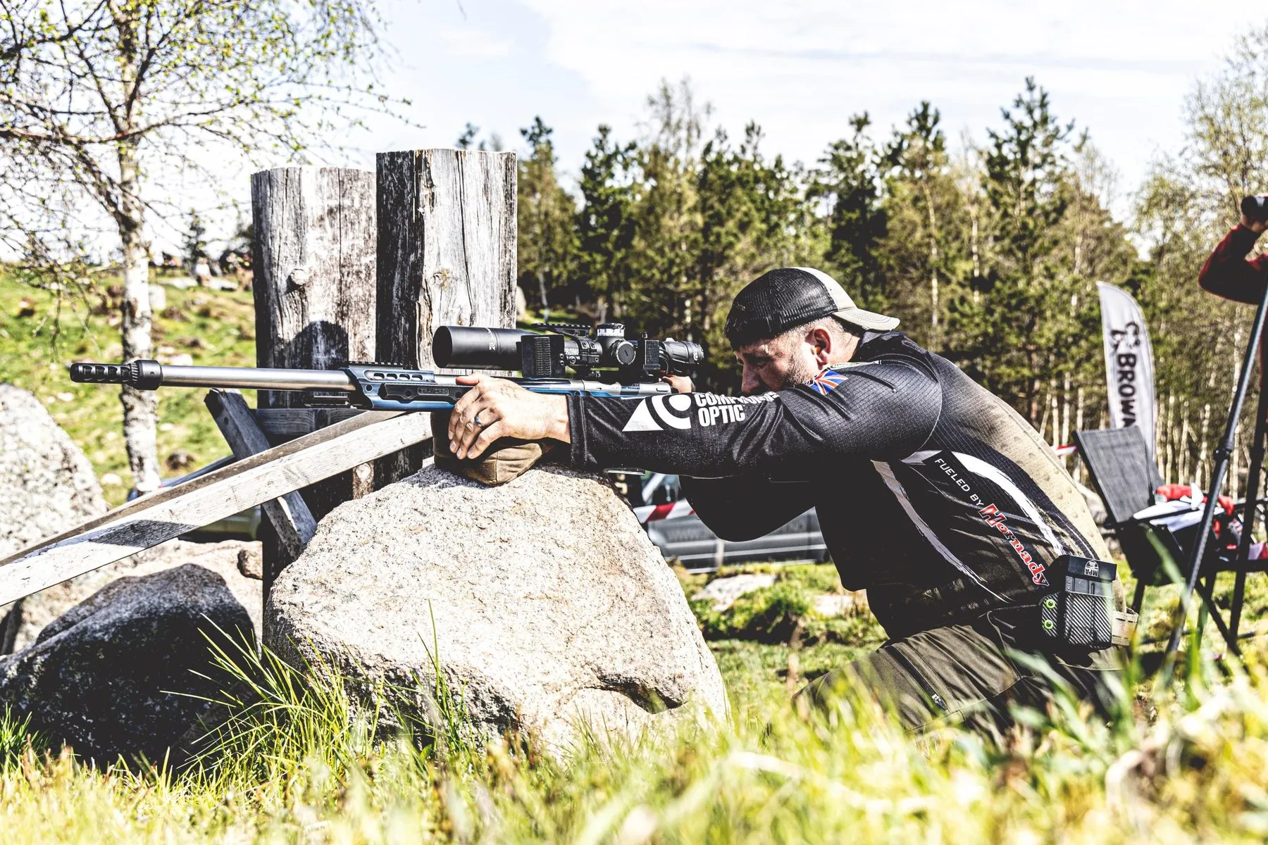 Josh Martin shooting from a rock barricade at a precision rifle match